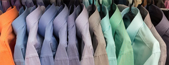 different coloured shirts on hangers
