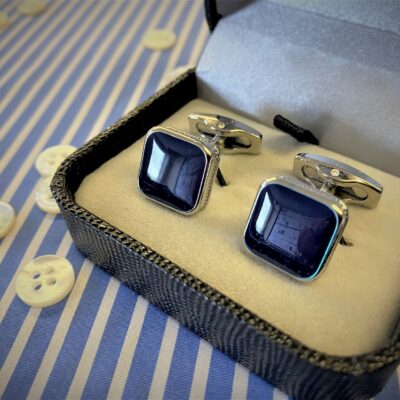 x1 pair of silver coloured cufflinks with blue inlay