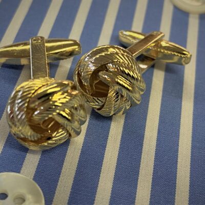 x1 pair of gold coloured knot cufflinks with box